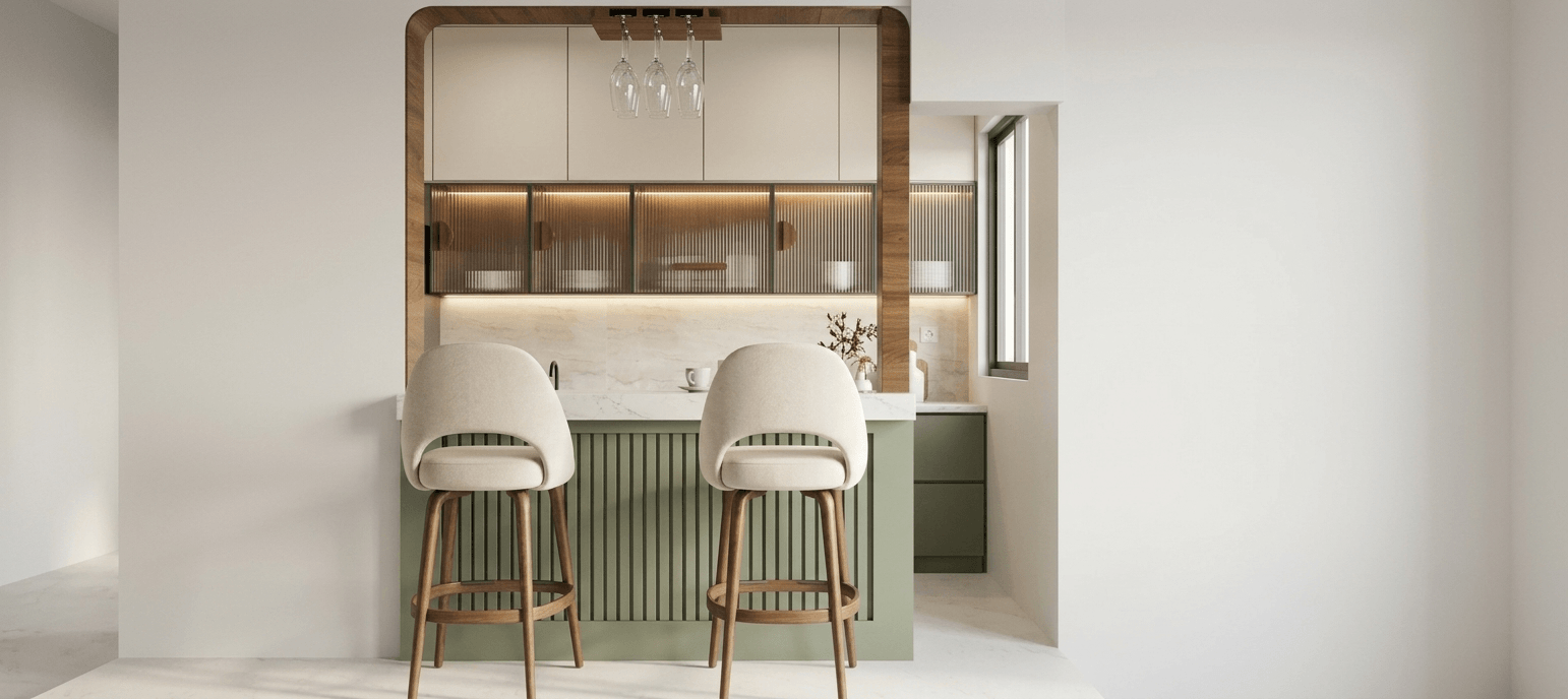 Side view of a modern kitchen with warm cabinetry and clean counters